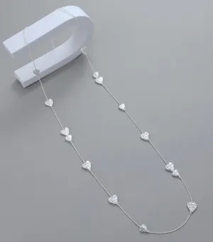 Long silver hammered hearts necklace