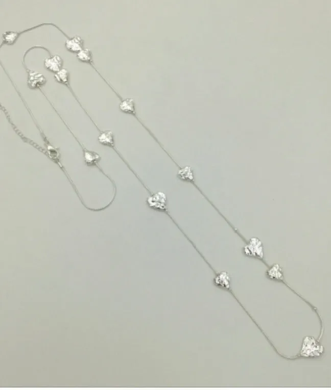 Long silver hammered hearts necklace