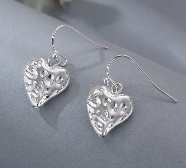 Long silver hammered hearts necklace