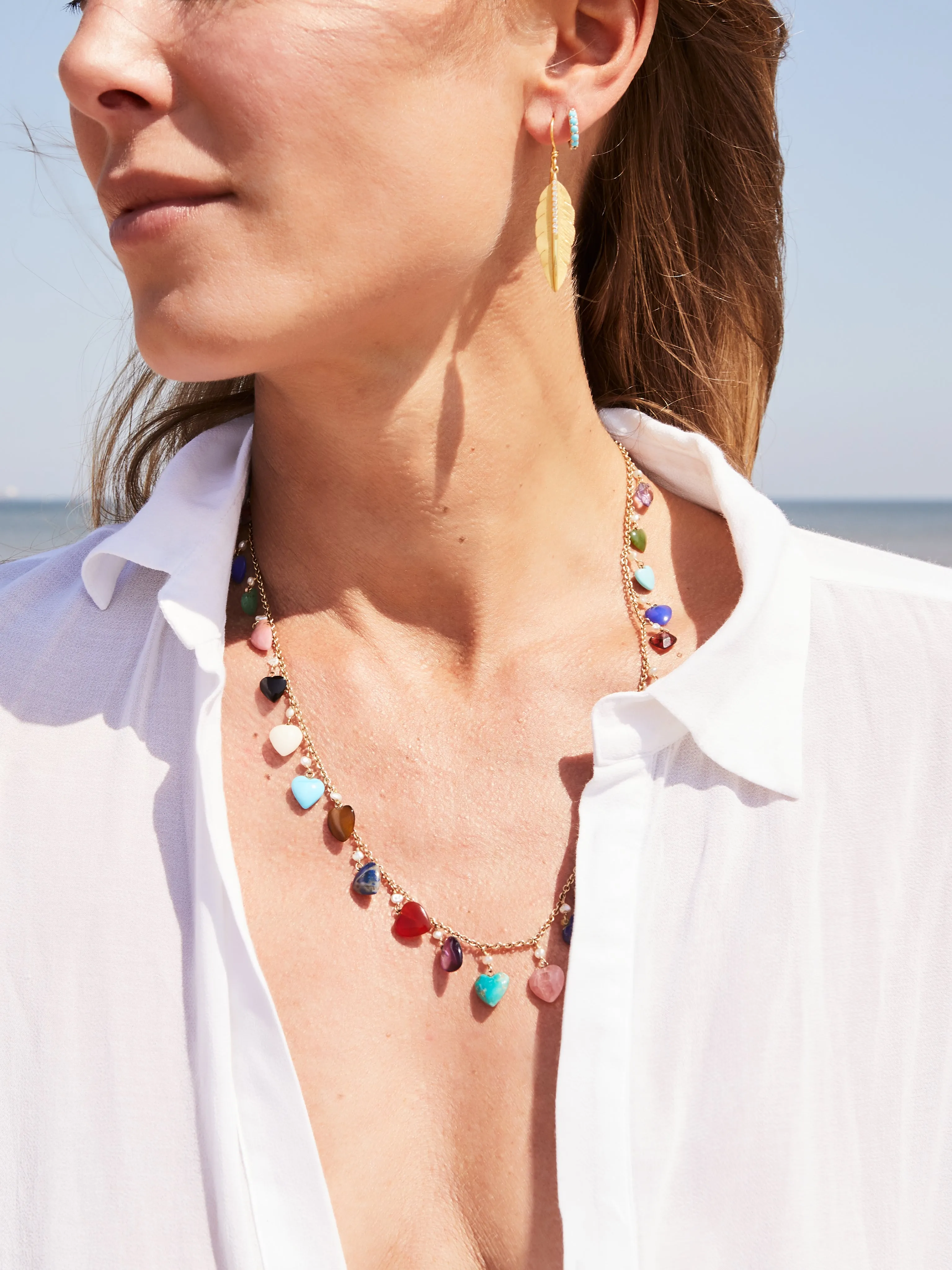 Necklace with heart shaped gemstones