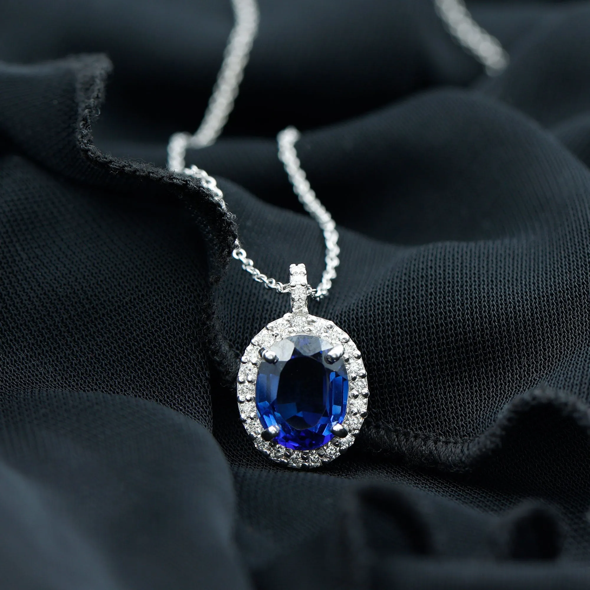 Oval Cut Created Blue Sapphire Silver Halo Pendant with Moissanite